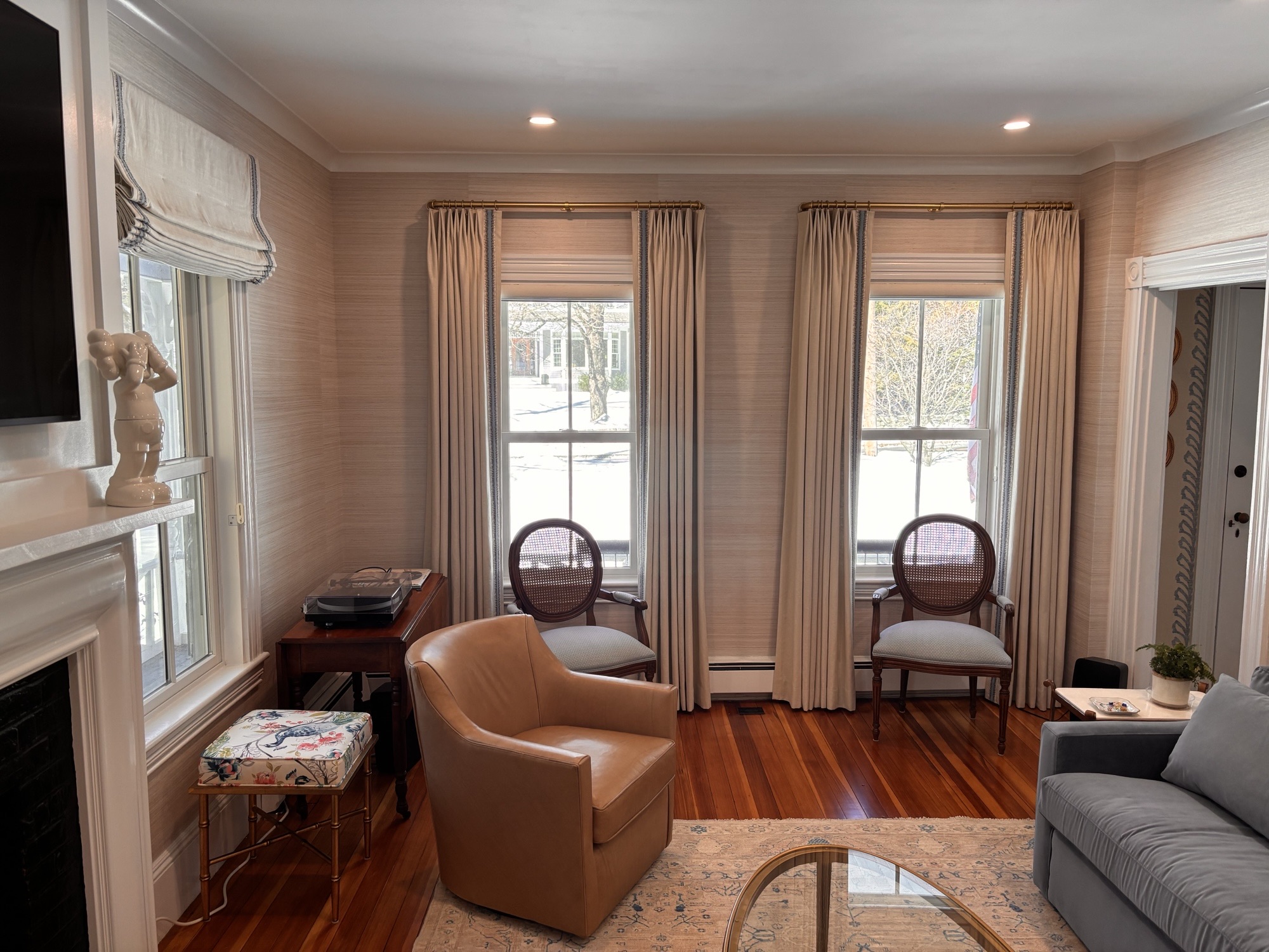 Custom upholstered accent chairs with drapery in traditional living room