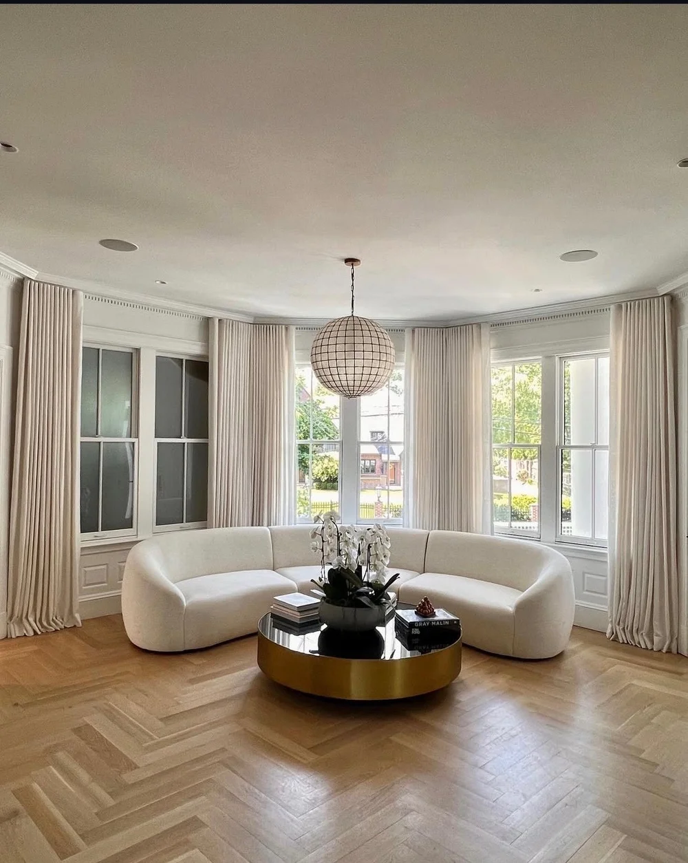 Elegant pleated drapes in bay window