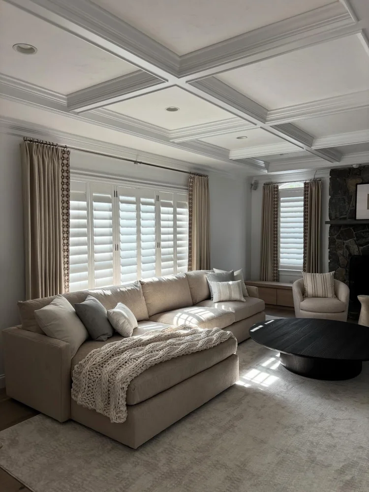 Plantation shutters with drapery