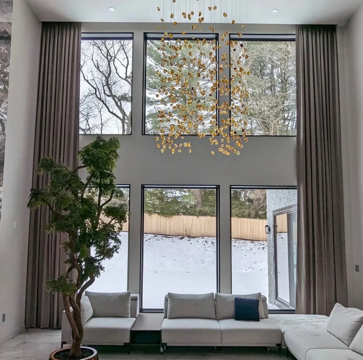 Floor-to-ceiling drapery in modern great room